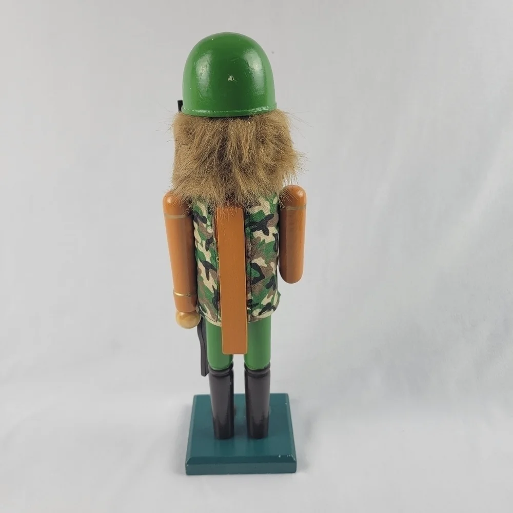 Wooden camouflage nutcracker with a rifle‎